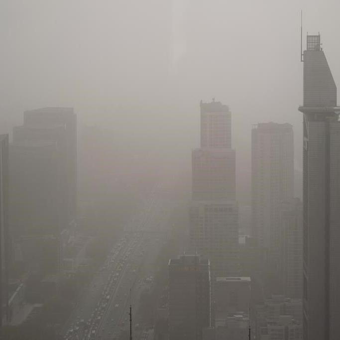 Northern China blanketed with floating sand and dust